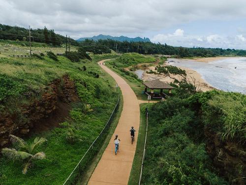Aerial view of cyclists on the Ke Ala Hele Makalae path ~ Hawaii Tourism Auth